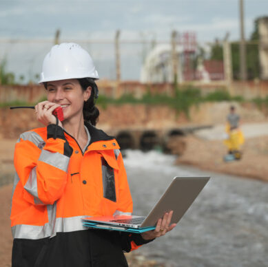 Lead environmental auditor reviewing EMS compliance procedures at an industrial site