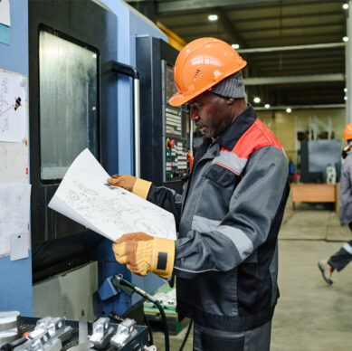 Product quality planning team reviewing manufacturing and process development procedures in an industrial environment