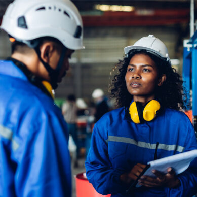 Integrated management system professionals implementing compliance procedures in an industrial facility