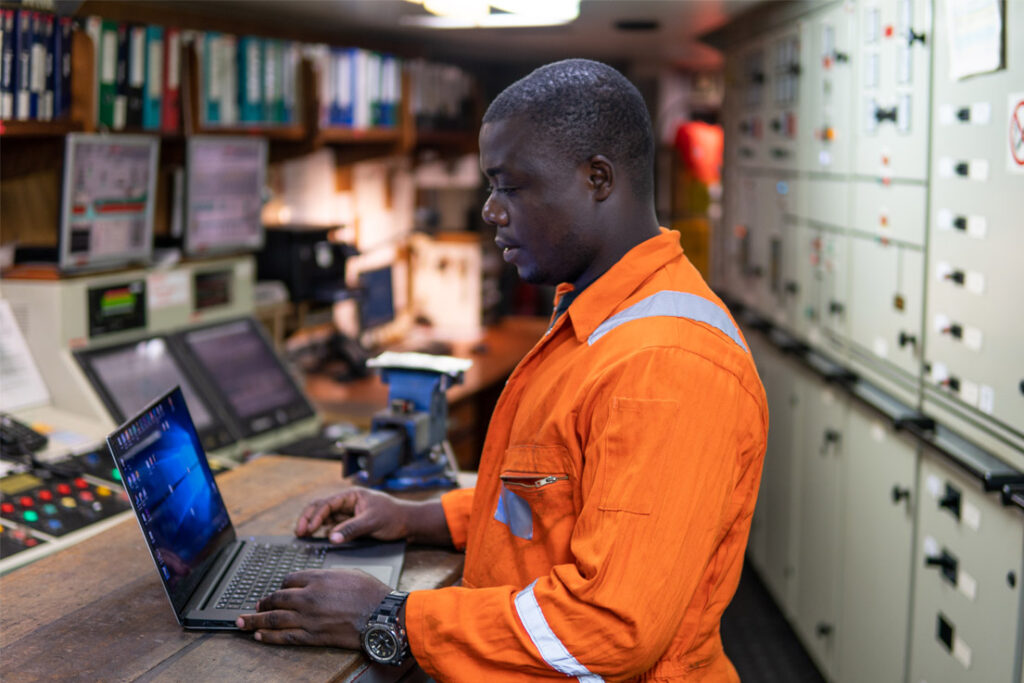 Energy management professionals reviewing energy efficiency procedures in an industrial facility