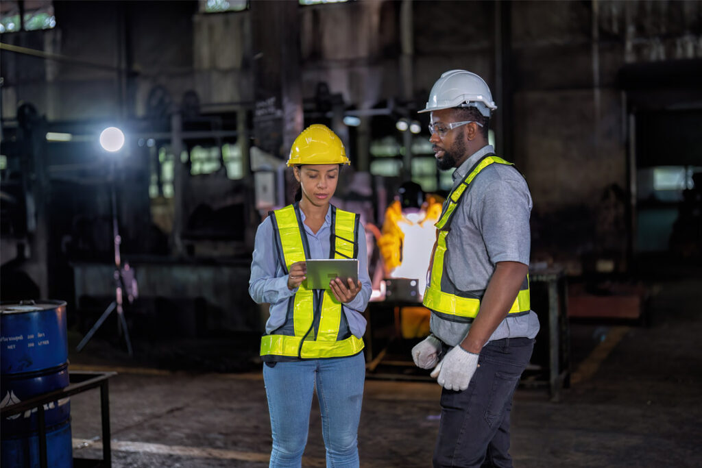 Inspection professionals reviewing compliance and inspection procedures at an industrial facility