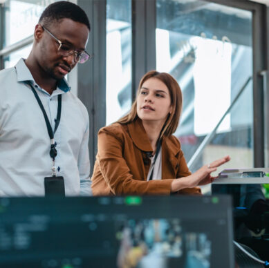 Information security auditor reviewing cybersecurity compliance procedures in a corporate environment