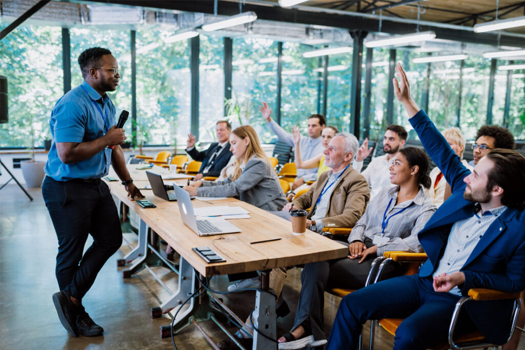 Quality management professionals reviewing operational procedures in a manufacturing facility
