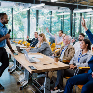 Quality management professionals reviewing operational procedures in a manufacturing facility